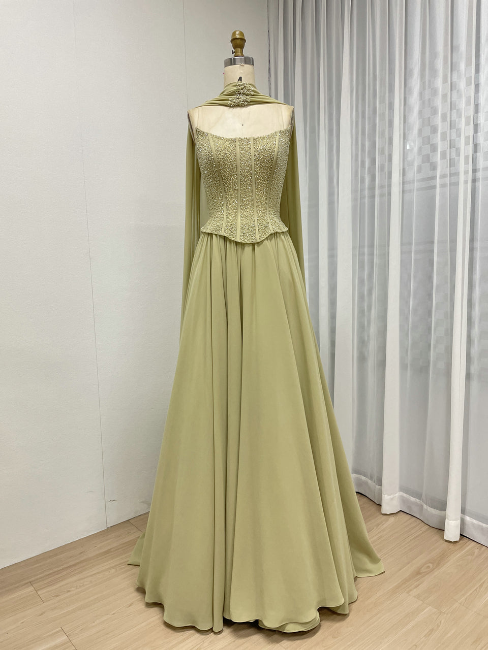 Elegant Flowing Green Formal Dress with Intricate Gold Beading MB40438
