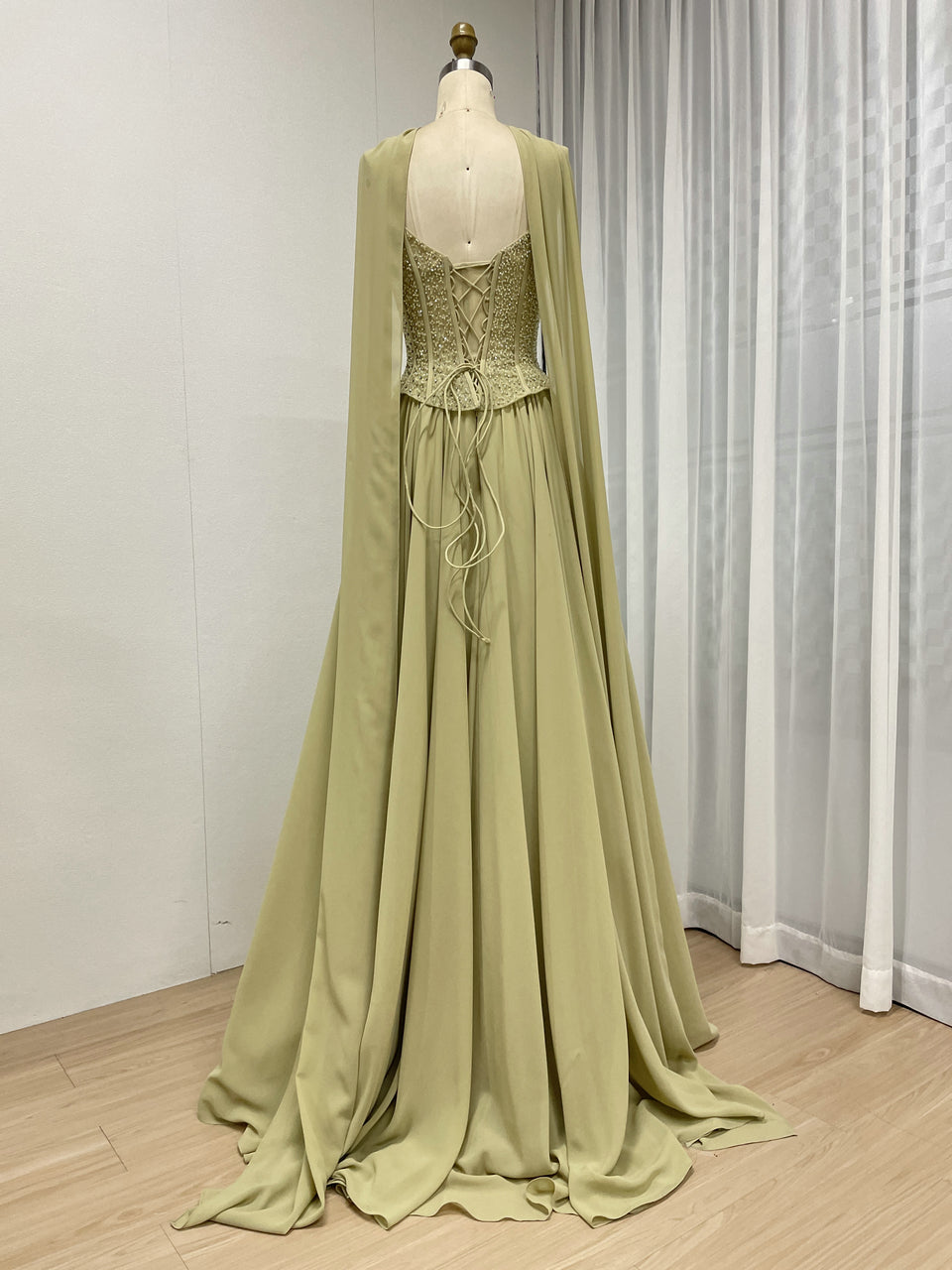 Elegant Flowing Green Formal Dress with Intricate Gold Beading MB40438