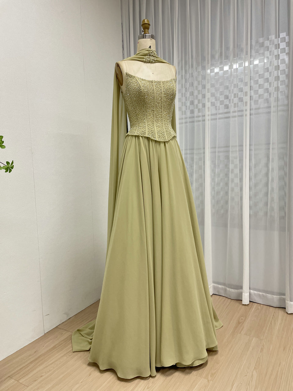 Elegant Flowing Green Formal Dress with Intricate Gold Beading MB40438