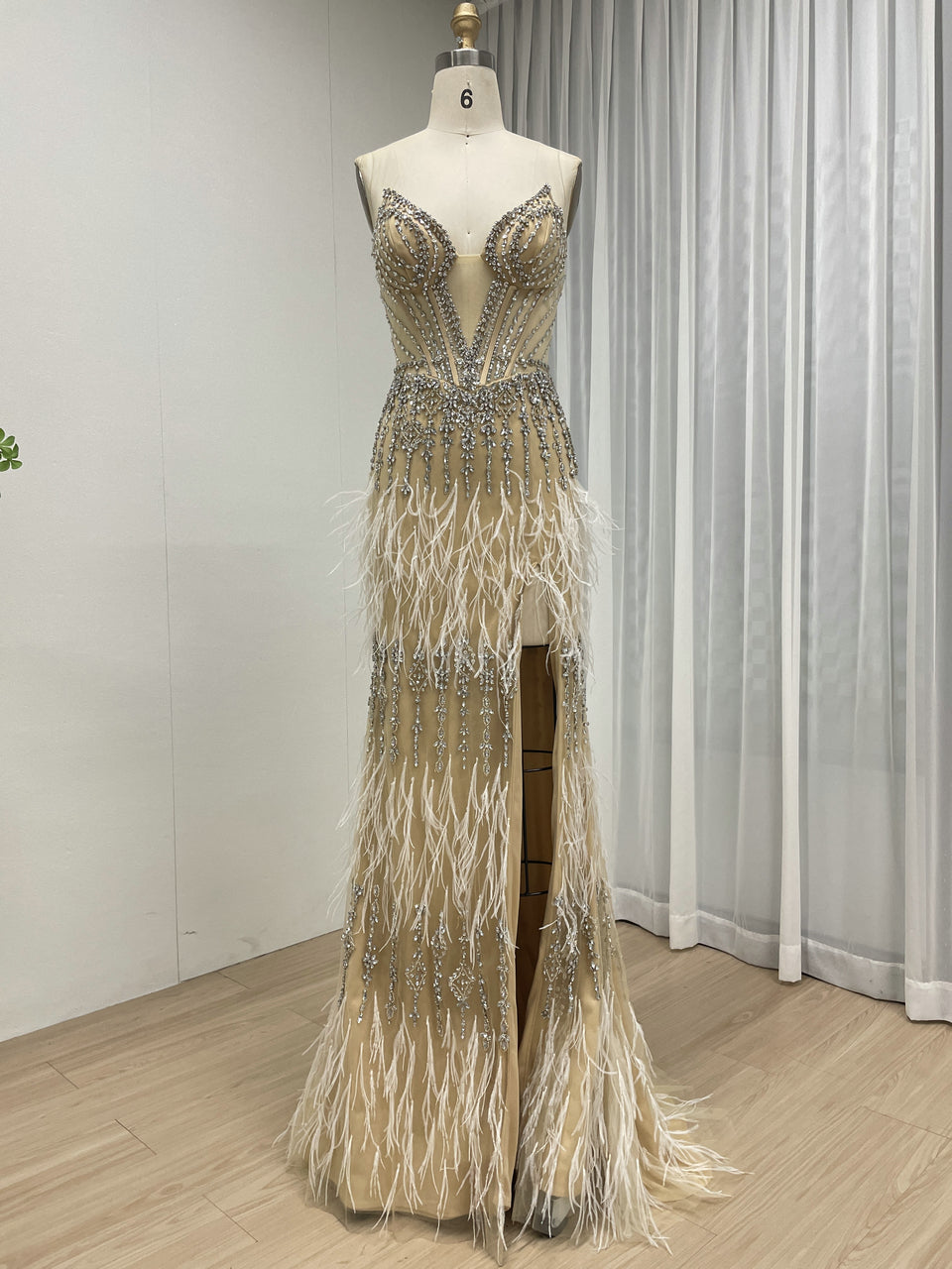 Luxe Champagne Beaded Evening Gown with Feather Hem & High Slit MC20127