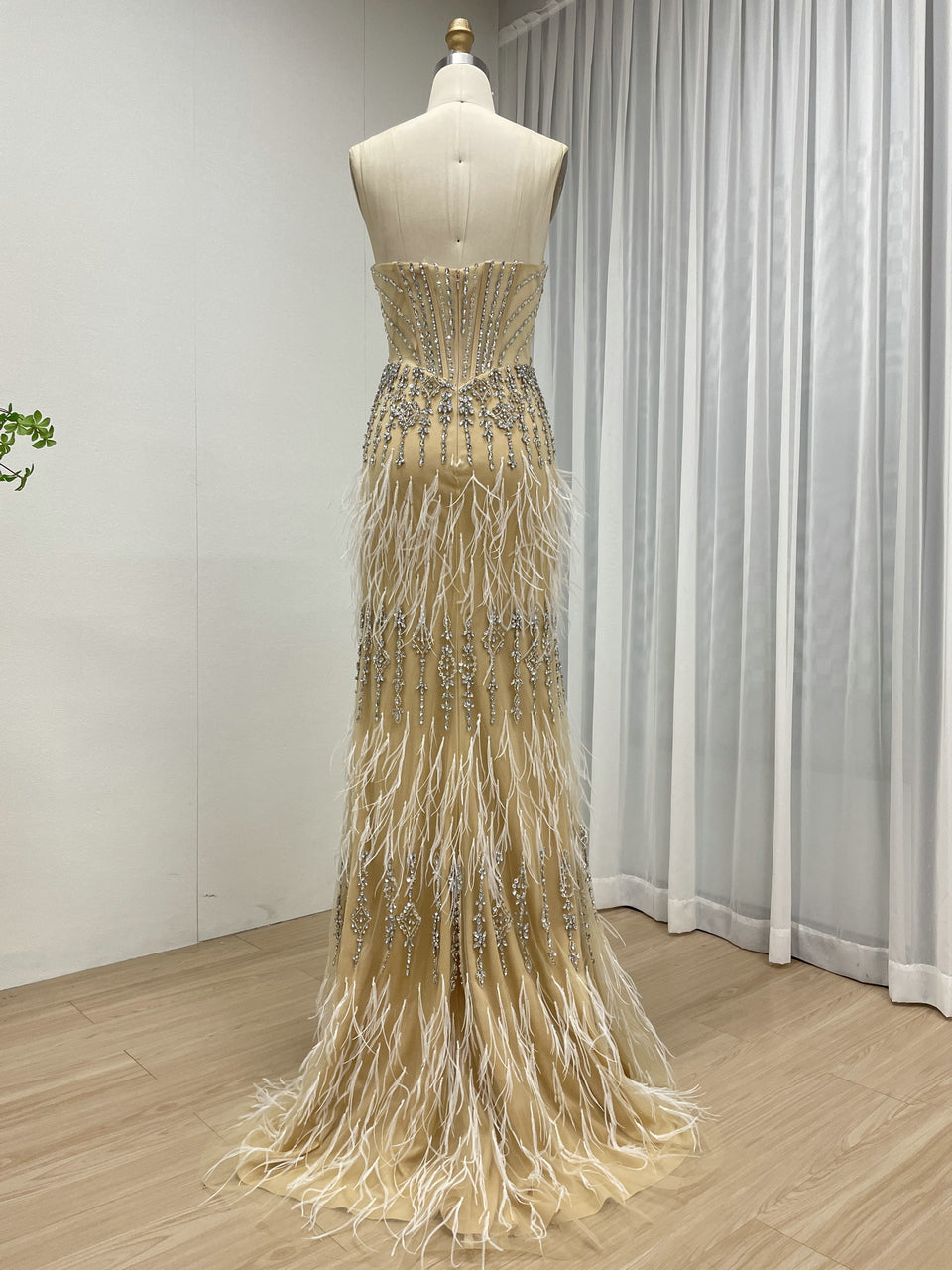 Luxe Champagne Beaded Evening Gown with Feather Hem & High Slit MC20127