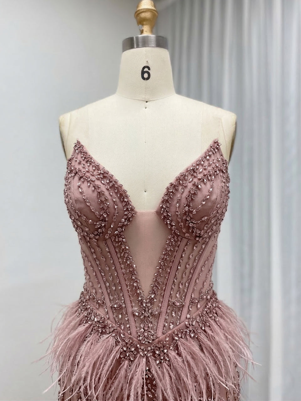 Luxe Champagne Beaded Evening Gown with Feather Hem & High Slit MC20127
