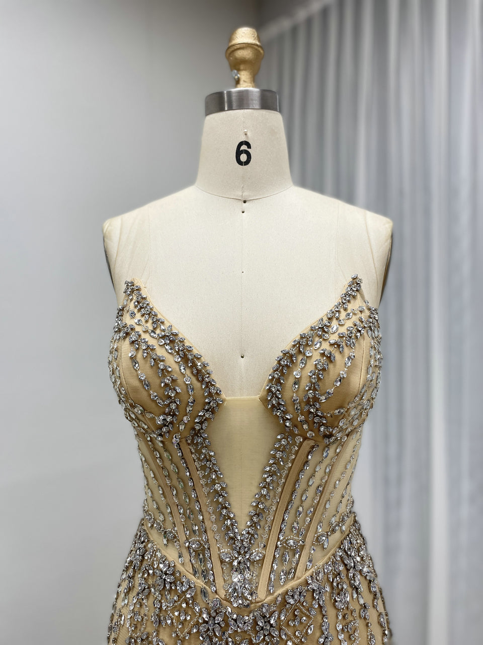 Luxe Champagne Beaded Evening Gown with Feather Hem & High Slit MC20127