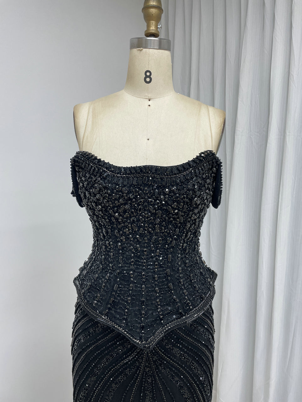 Black Beaded Evening Gown with Sheer Draped Cape Sleeves and Corset Bodice MC20187
