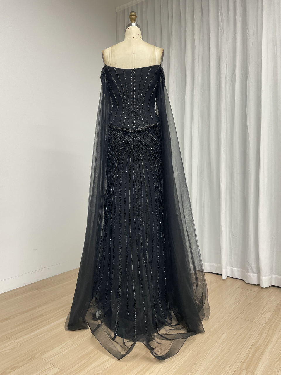 Black Beaded Evening Gown with Sheer Draped Cape Sleeves and Corset Bodice MC20187