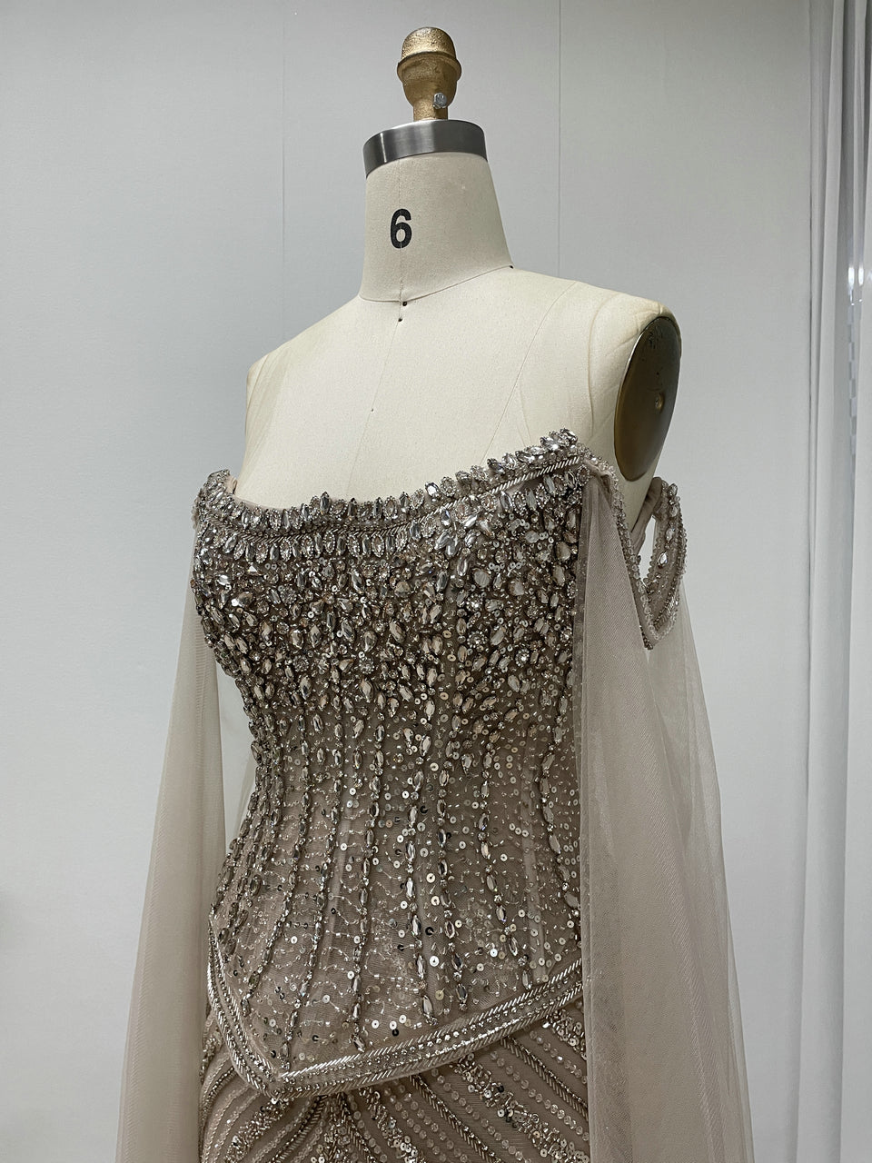 Black Beaded Evening Gown with Sheer Draped Cape Sleeves and Corset Bodice MC20187